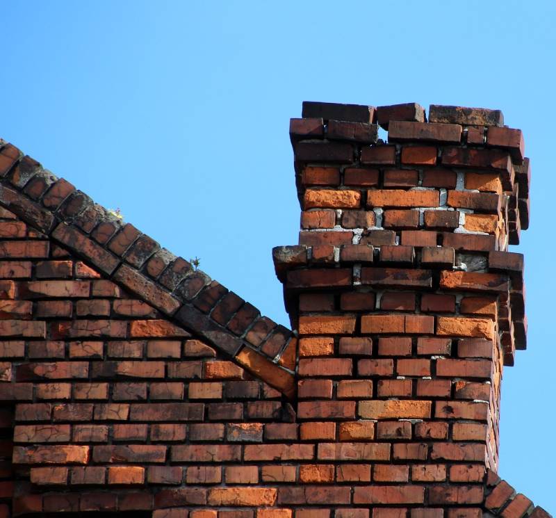 Damaged chimney on an Southgate home showing cracks and missing mortar